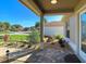 Beautifully landscaped front yard and entrance with stone pavers and manicured plants at 1914 Armondo Dr, The Villages, FL 32159