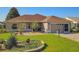 Charming single-story home with a manicured lawn and inviting curb appeal at 1914 Armondo Dr, The Villages, FL 32159