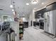 Contemporary kitchen with black cabinetry, stainless steel appliances, and stylish pendant lights at 1914 Armondo Dr, The Villages, FL 32159