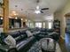 Spacious living room with hardwood floors, ceiling fan, and modern decor at 1914 Armondo Dr, The Villages, FL 32159