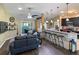Open-concept living room with a kitchen view, perfect for entertaining and Gathering gatherings at 1914 Armondo Dr, The Villages, FL 32159