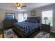 Main bedroom suite features a large bed, dresser with mirror, and lots of natural light at 1914 Armondo Dr, The Villages, FL 32159