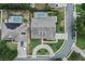Aerial view of the house and neighborhood, highlighting nearby pools, and green spaces at 19624 Spring Oak Dr, Eustis, FL 32736