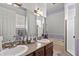 The bathroom features double sinks, granite countertops, and a separate shower and tub at 19624 Spring Oak Dr, Eustis, FL 32736