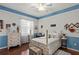 Inviting bedroom featuring hardwood floors, soft natural light, and decorative details at 19624 Spring Oak Dr, Eustis, FL 32736