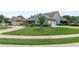 Home showcasing a circular driveway, a lush lawn, and mature trees, adding to its curb appeal at 19624 Spring Oak Dr, Eustis, FL 32736