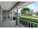 Inviting front porch with decorative columns and serene neighborhood views at 19624 Spring Oak Dr, Eustis, FL 32736