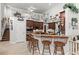 Open concept kitchen featuring a breakfast bar with seating, ample cabinet space, and modern appliances at 19624 Spring Oak Dr, Eustis, FL 32736