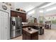 The bright kitchen features stainless steel appliances, granite countertops, and a cozy breakfast nook at 19624 Spring Oak Dr, Eustis, FL 32736