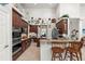 Well-equipped kitchen with ample counter space, wooden cabinetry, and a breakfast bar for casual dining at 19624 Spring Oak Dr, Eustis, FL 32736