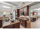 Bright kitchen boasts stainless appliances, custom cabinets, and granite countertops at 19624 Spring Oak Dr, Eustis, FL 32736