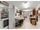 Well-organized laundry room featuring dark wood cabinets, granite countertops, and washer and dryer at 19624 Spring Oak Dr, Eustis, FL 32736