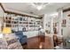 Charming living room featuring built-in bookcase and comfortable seating area, ideal for reading and relaxing at 19624 Spring Oak Dr, Eustis, FL 32736