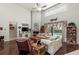 Bright living room boasts high ceilings, fireplace, comfortable seating, and backyard access through sliding glass doors at 19624 Spring Oak Dr, Eustis, FL 32736