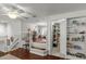 Open-concept living space with hardwood floors and built-in shelving, perfect for entertaining at 19624 Spring Oak Dr, Eustis, FL 32736