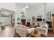 Inviting living room with tall ceilings, a fireplace, and comfortable seating arrangement perfect for entertaining guests at 19624 Spring Oak Dr, Eustis, FL 32736