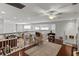 Spacious loft with hardwood floors and a view of the living area below, perfect for a study at 19624 Spring Oak Dr, Eustis, FL 32736