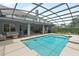 Relaxing screened-in pool and covered patio, perfect for entertaining at 19624 Spring Oak Dr, Eustis, FL 32736