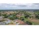 Picturesque community featuring beautiful homes, golf course, tennis courts, and a clubhouse surrounded by lush trees at 1972 Palo Alto Ave, The Villages, FL 32159