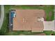 Aerial view of the entire roof of a home with a screened-in pool at 1972 Palo Alto Ave, The Villages, FL 32159