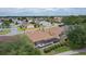 Backyard pool, screened-in lanai, manicured lawn, and lovely landscaping in quiet residential neighborhood at 1972 Palo Alto Ave, The Villages, FL 32159
