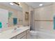 Bright bathroom featuring a tiled shower and bathtub combination for a clean, modern look at 1972 Palo Alto Ave, The Villages, FL 32159