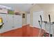 Bonus room with hardwood floors, large closet and white built-in storage for a modern aesthetic at 1972 Palo Alto Ave, The Villages, FL 32159