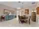 Dining room featuring a wooden table set, chandelier, and elegant wainscoting at 1972 Palo Alto Ave, The Villages, FL 32159