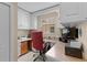 A cozy home office with custom cabinetry and a comfortable workspace awaits remote work or creative projects at 1972 Palo Alto Ave, The Villages, FL 32159