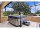 Screened-in hot tub area for relaxing and enjoying the outdoors in this backyard oasis at 1972 Palo Alto Ave, The Villages, FL 32159