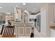 Kitchen area featuring an island with stone countertops, breakfast bar, and modern stainless steel appliances at 1972 Palo Alto Ave, The Villages, FL 32159