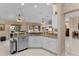 Kitchen area featuring stone countertops, stainless steel dishwasher, and ample counter space at 1972 Palo Alto Ave, The Villages, FL 32159