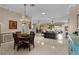 Spacious and bright open floor plan with dining area and living room with ceramic tile flooring at 1972 Palo Alto Ave, The Villages, FL 32159