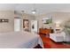 Comfortable main bedroom with hardwood floors, a ceiling fan and crown molding at 1972 Palo Alto Ave, The Villages, FL 32159