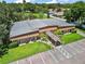 Unique building featuring modern architecture, well maintained landscaping and ample parking at 2110 Oak Cir, Mount Dora, FL 32757