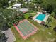 Aerial view of community amenities, featuring shuffleboard courts and a sparkling swimming pool at 2110 Oak Cir, Mount Dora, FL 32757