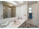 Cozy bathroom with a shower over the bathtub and a vanity with white countertops and hardware at 2110 Oak Cir, Mount Dora, FL 32757