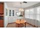 Charming dining area with a round table, built-in cabinets, and natural light at 2110 Oak Cir, Mount Dora, FL 32757