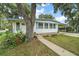 Charming home with a well-maintained lawn and mature trees, offering a welcoming and serene setting at 2110 Oak Cir, Mount Dora, FL 32757