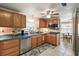 Functional kitchen with oak cabinets, stainless steel appliances, and a view into the dining area at 2110 Oak Cir, Mount Dora, FL 32757