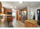 Well-lit kitchen featuring wooden cabinets, stainless steel appliances, and tile flooring at 2110 Oak Cir, Mount Dora, FL 32757