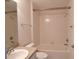 Standard bathroom featuring a shower-tub combination, white tile surround, and neutral vanity at 2120 Willow Grove Way, The Villages, FL 32162