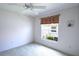 Bedroom with a ceiling fan and natural light entering through a window at 2120 Willow Grove Way, The Villages, FL 32162