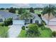 Charming single-story home with well-maintained landscaping and a two-car garage at 2120 Willow Grove Way, The Villages, FL 32162