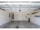 Spacious two-car garage with ample storage shelving, water heater, and utility panel at 2120 Willow Grove Way, The Villages, FL 32162