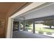 Enclosed patio area with a ceiling fan and screened windows providing a serene outdoor retreat at 2120 Willow Grove Way, The Villages, FL 32162
