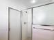 This bathroom features a glass shower enclosure with tiled walls and mosaic flooring at 2202 Kershaw Rd, The Villages, FL 32162