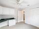 Bedroom with white cabinets and a ceiling fan, blending functionality with comfort and convenience at 2202 Kershaw Rd, The Villages, FL 32162