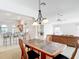 Spacious dining room open to the kitchen and living areas, great for entertaining at 2202 Kershaw Rd, The Villages, FL 32162