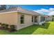 Well-maintained exterior showcasing the lanai and lush lawn at 2202 Kershaw Rd, The Villages, FL 32162